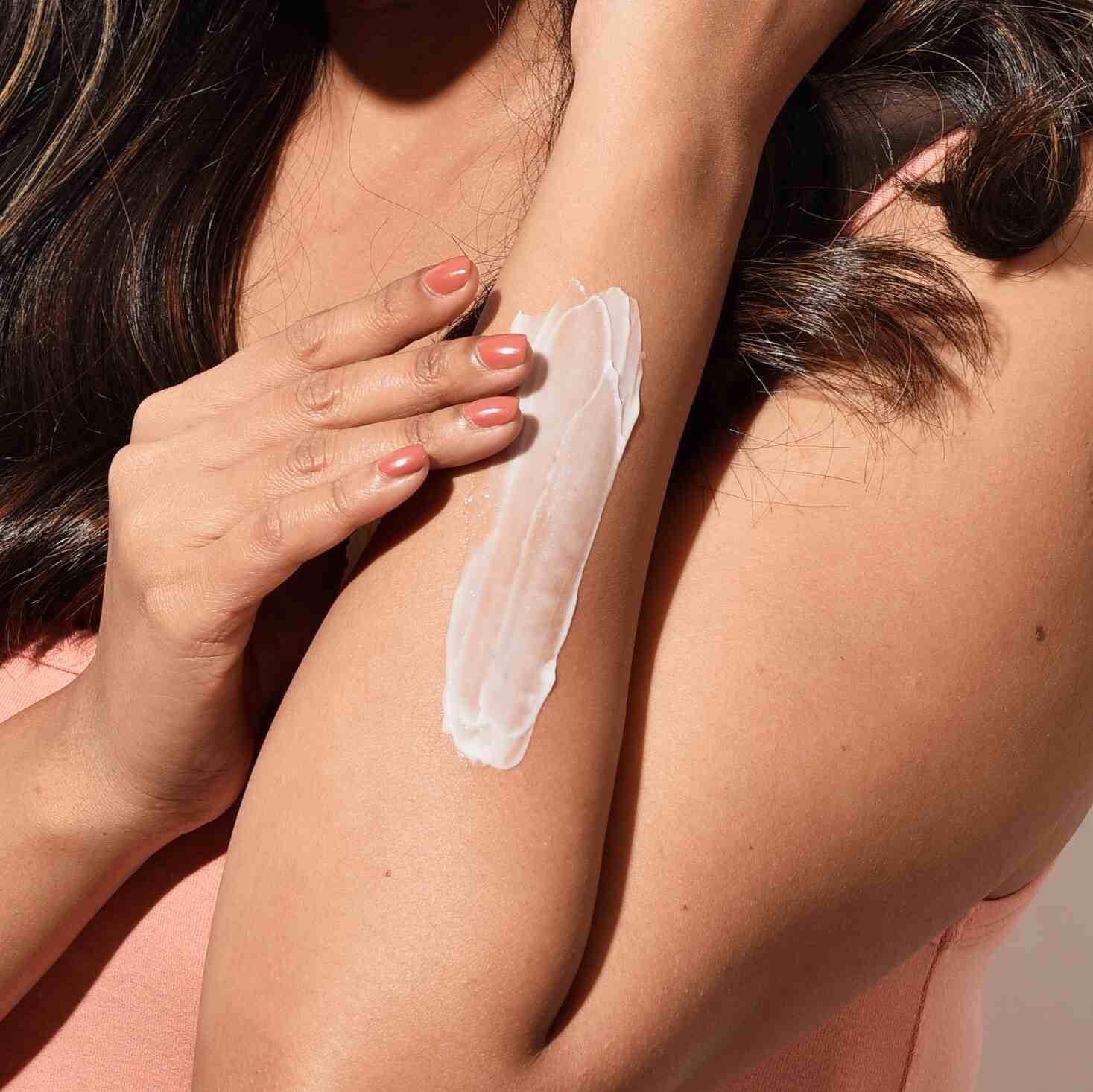 Person with tanned skin before detan treatment